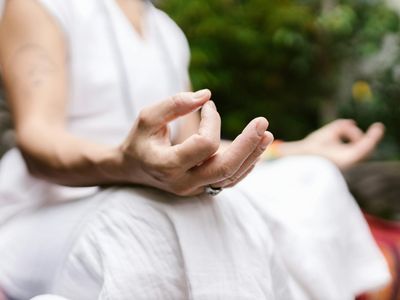 Close up of a person hands in a mudra position.