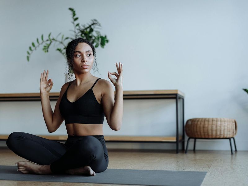 Minimalist zen yoga studio with warm lighting and mats.